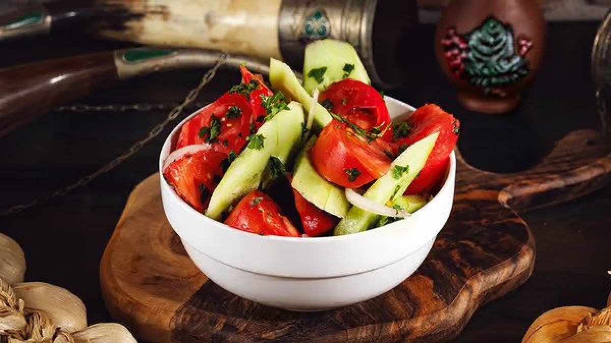 Cucumber tomato salad - Georgian dish at Tbilisuri Ezo restaurant in Tbilisi }}