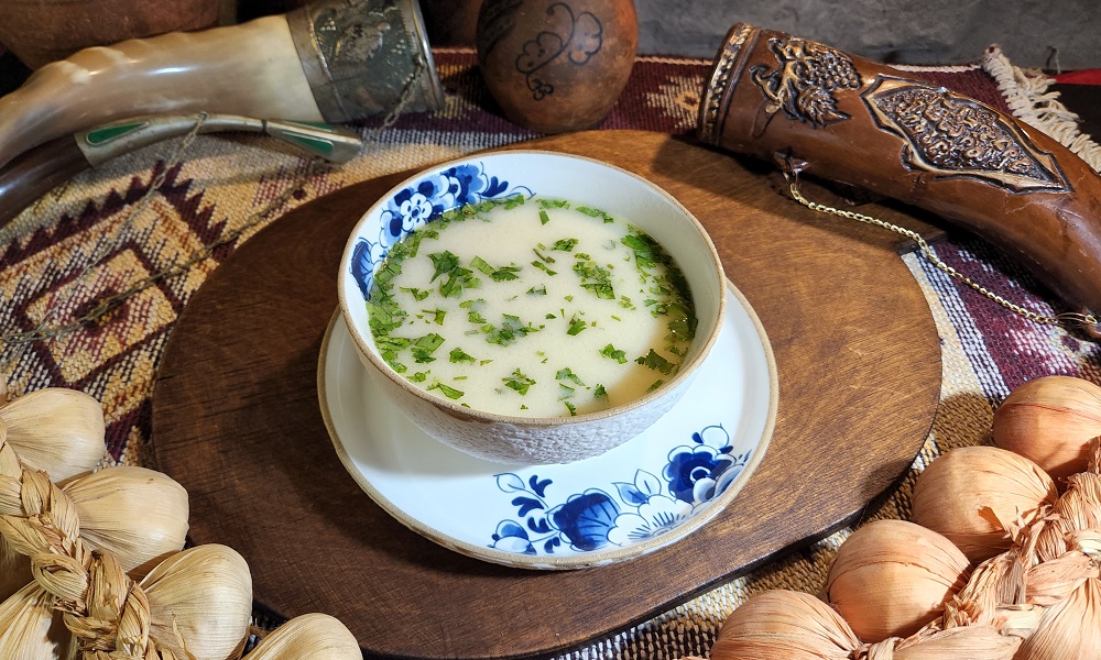 Chikhirtma with chicken - Georgian dish at Tbilisuri Ezo restaurant in Tbilisi }}