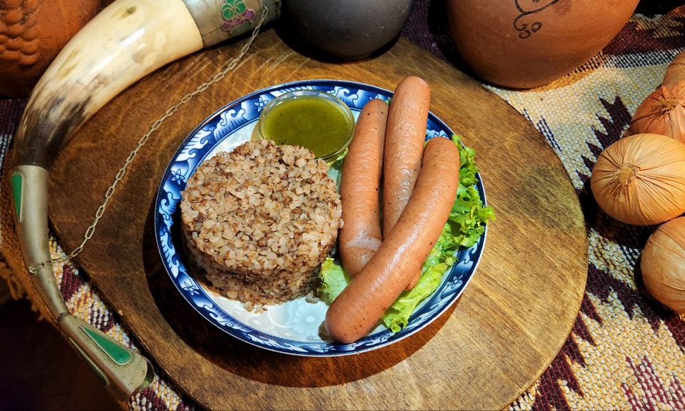 Sausage With Buckwheat Garnish - Georgian dish at Tbilisuri Ezo restaurant in Tbilisi }}