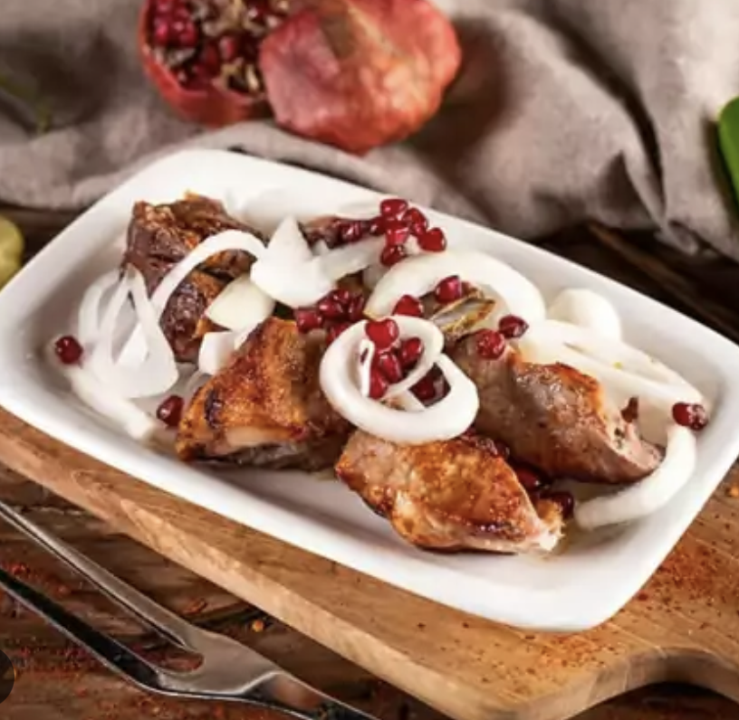 Pork Barbecue - Georgian dish at Tbilisuri Ezo restaurant in Tbilisi }}