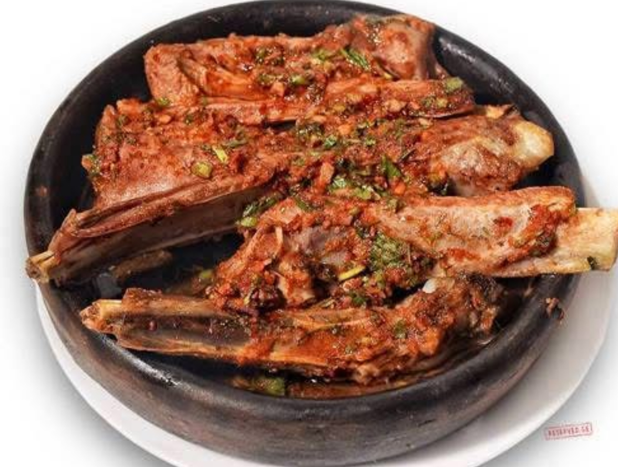 Lamb ribs in Adjika at Tbilisuri Ezo Georgian restaurant in Tbilisi }}