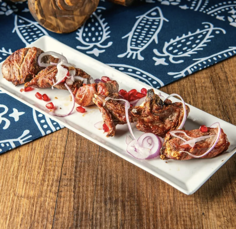 Lamb barbecue - Georgian dish at Tbilisuri Ezo restaurant in Tbilisi }}