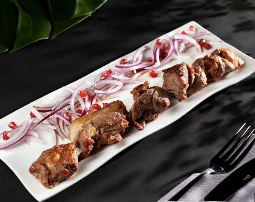 Veal barbecue - Georgian dish at Tbilisuri Ezo restaurant in Tbilisi }}