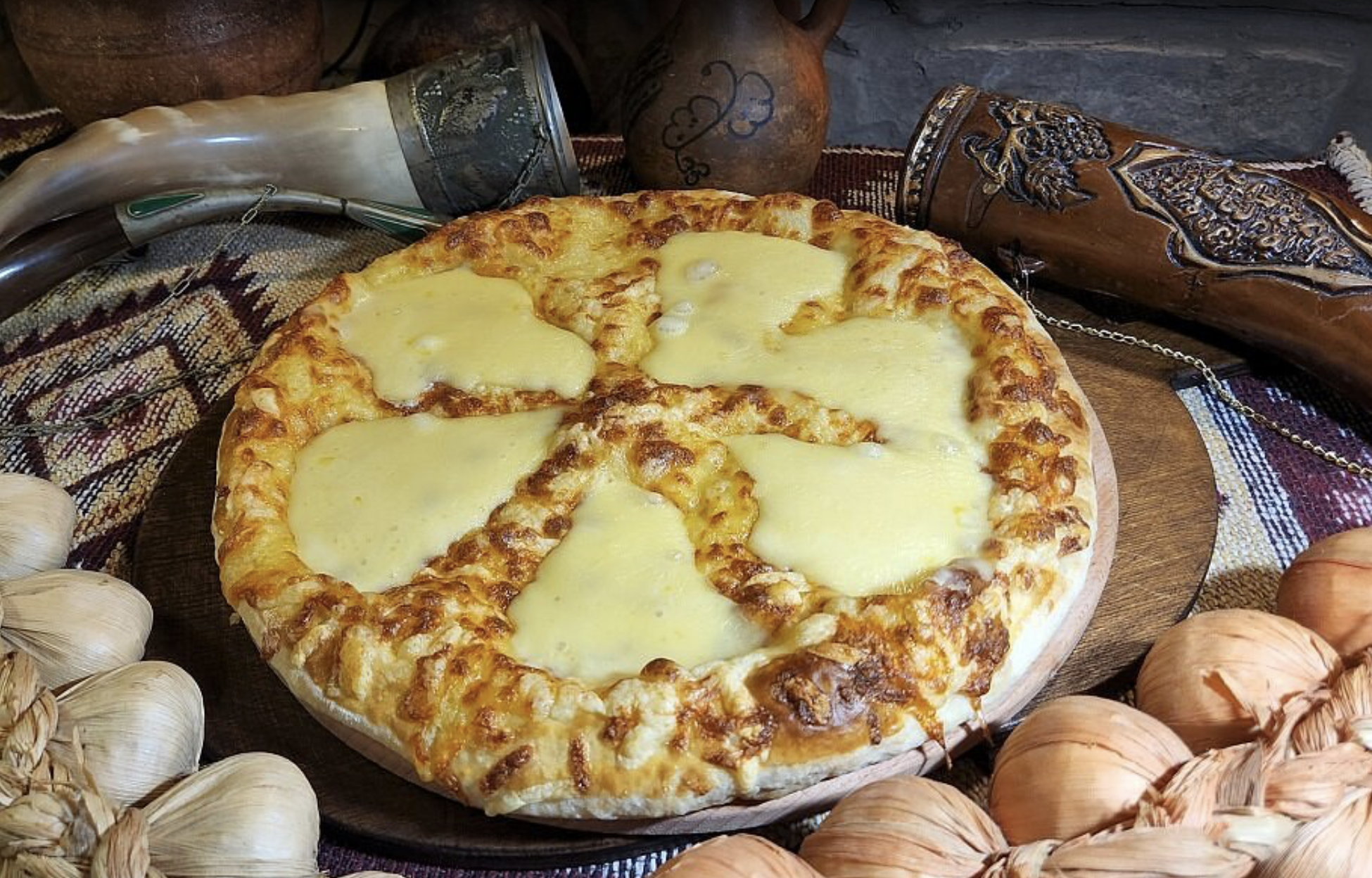 Royal Khachapuri - Georgian dish at Tbilisuri Ezo restaurant in Tbilisi }}