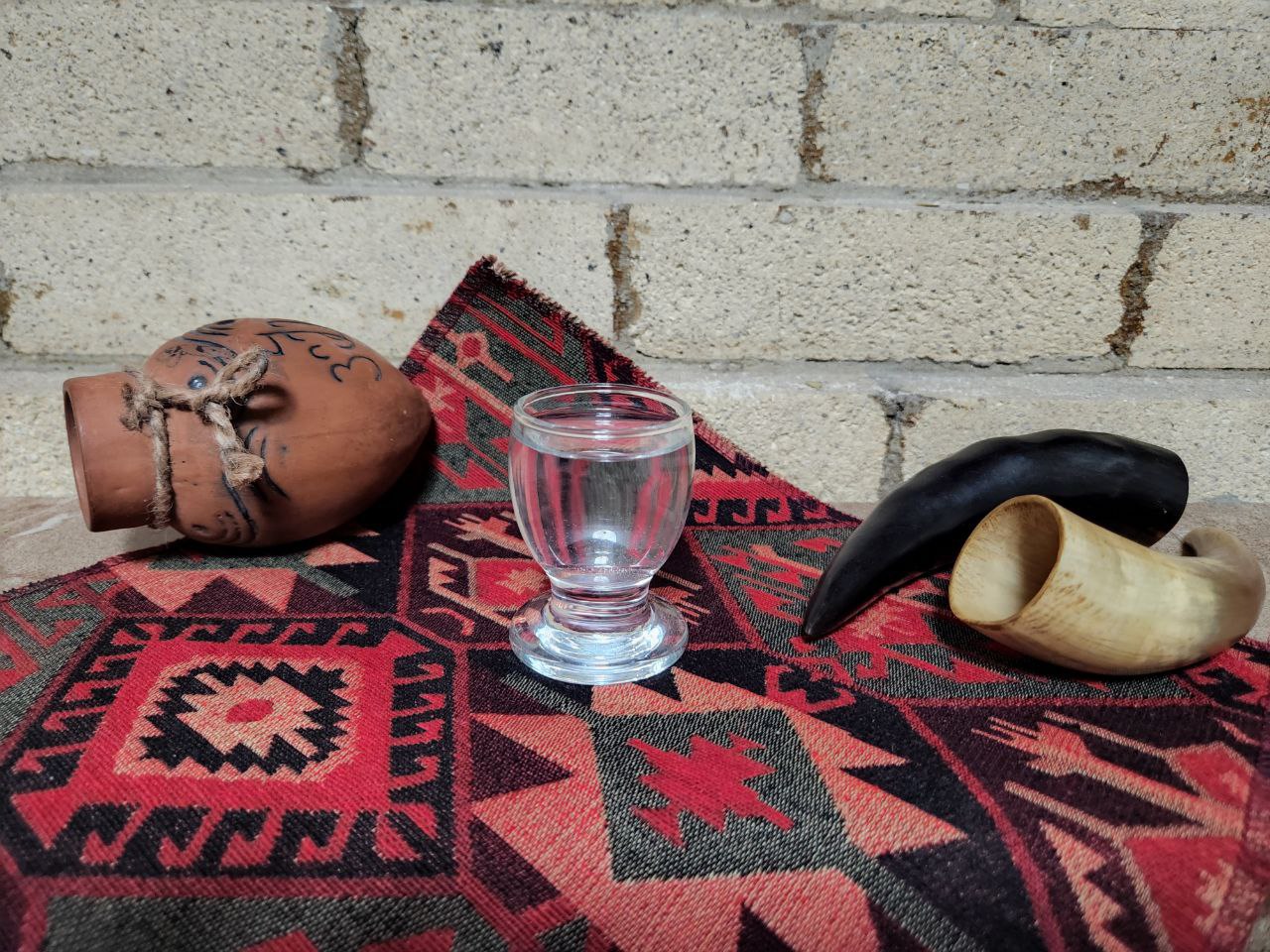 Chacha Kakhuri for bottling 1 glass - Georgian dish at Tbilisuri Ezo restaurant in Tbilisi }}