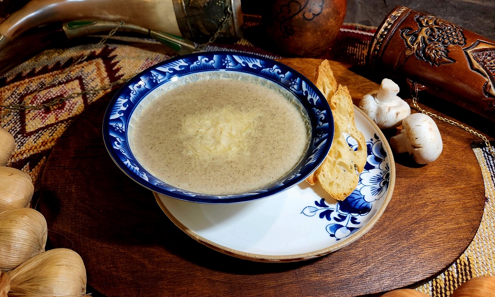 Mushroom cream-soup - Georgian dish at Tbilisuri Ezo restaurant in Tbilisi }}