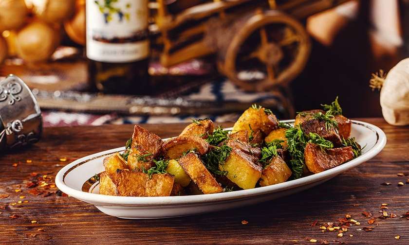 Family Fried Potatoes at Tbilisuri Ezo Georgian restaurant in Tbilisi }}