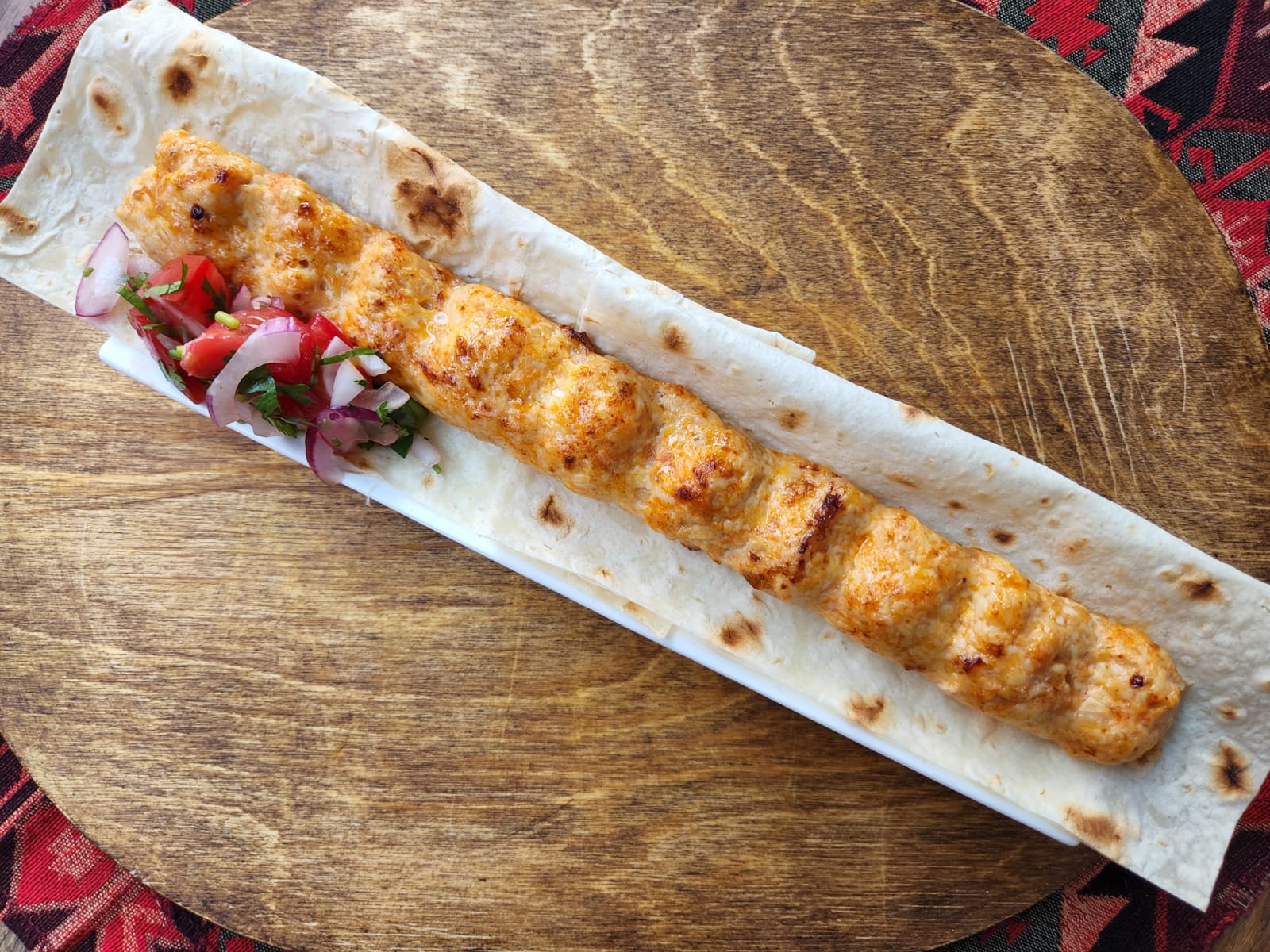 Kebab with chicken meat - Georgian dish at Tbilisuri Ezo restaurant in Tbilisi }}