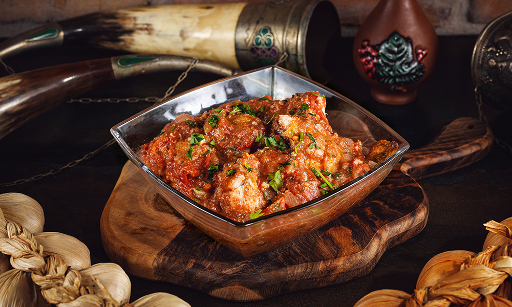 Chakhokhbili - Georgian dish at Tbilisuri Ezo restaurant in Tbilisi }}